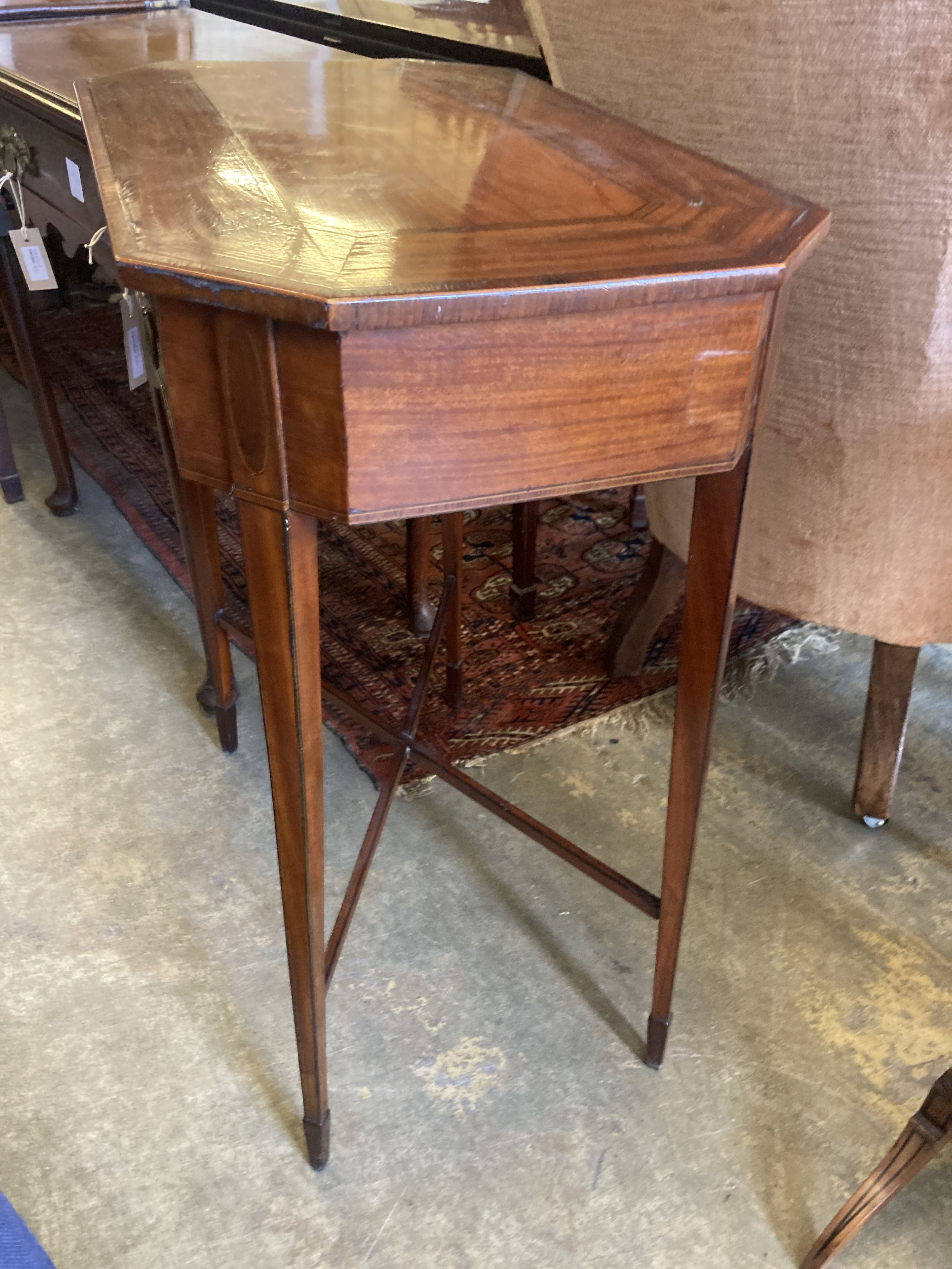 A George III Sheraton style inlaid mahogany side table of canted rectangular form, width 62cm, depth 37cm, height 75cm